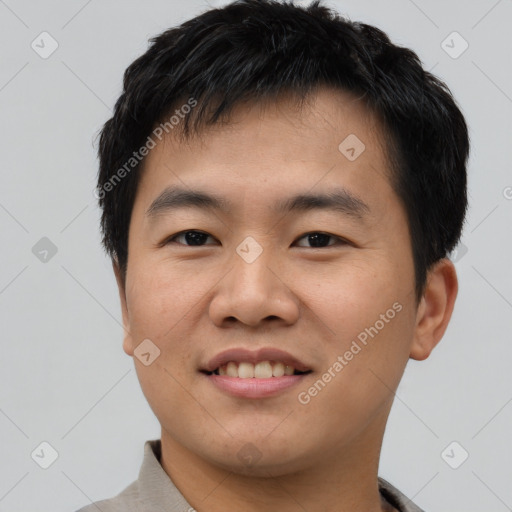 Joyful asian young-adult male with short  brown hair and brown eyes