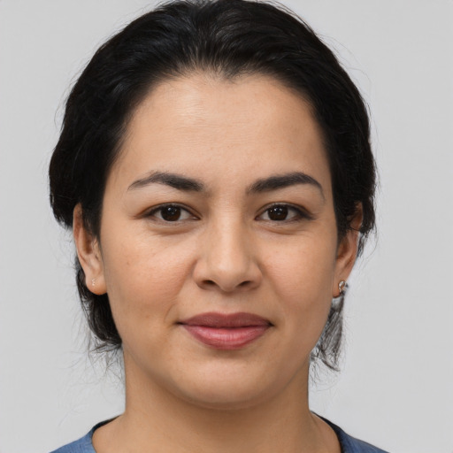 Joyful asian young-adult female with medium  brown hair and brown eyes