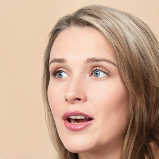 Joyful white young-adult female with long  brown hair and green eyes