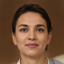 Joyful white young-adult female with short  brown hair and brown eyes