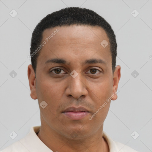 Joyful latino young-adult male with short  brown hair and brown eyes