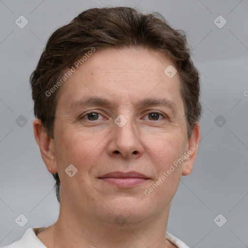 Joyful white adult male with short  brown hair and grey eyes