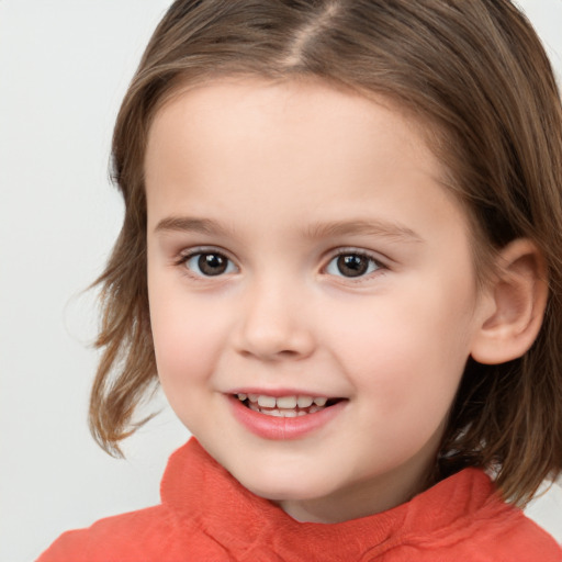 Joyful white child female with medium  brown hair and brown eyes