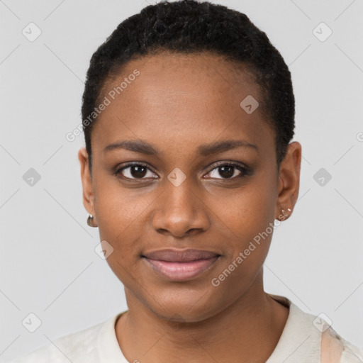 Joyful black young-adult female with short  black hair and brown eyes