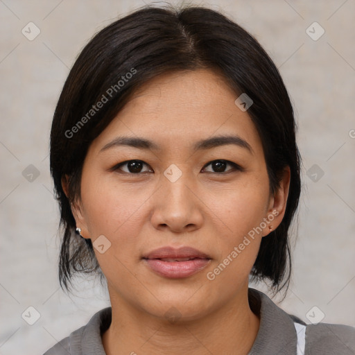 Joyful asian young-adult female with medium  black hair and brown eyes