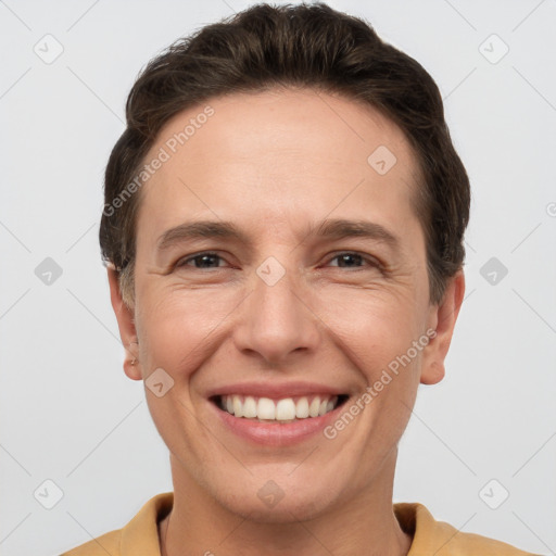 Joyful white adult male with short  brown hair and grey eyes