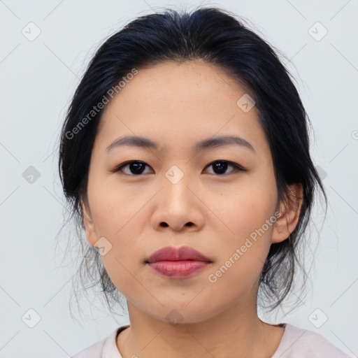 Joyful asian young-adult female with medium  black hair and brown eyes