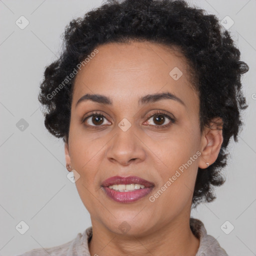 Joyful black young-adult female with short  brown hair and brown eyes