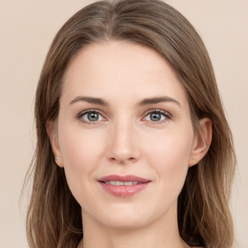 Joyful white young-adult female with long  brown hair and grey eyes