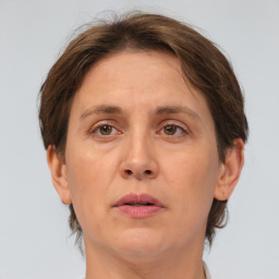 Joyful white adult female with short  brown hair and brown eyes
