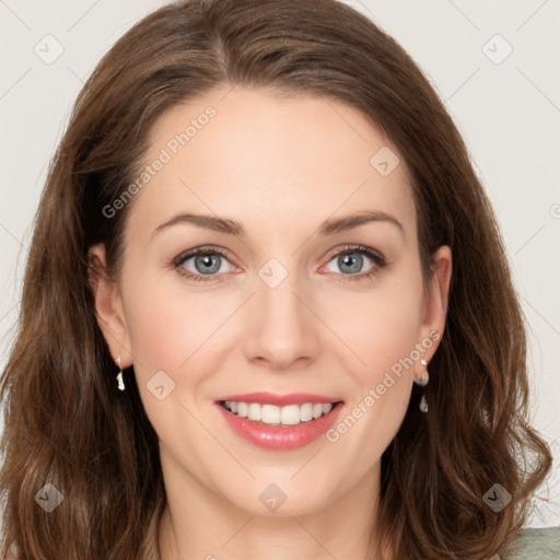 Joyful white young-adult female with long  brown hair and green eyes