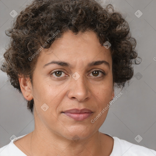 Joyful white adult female with short  brown hair and brown eyes