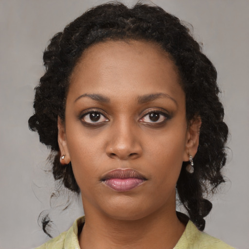 Neutral black young-adult female with medium  black hair and brown eyes