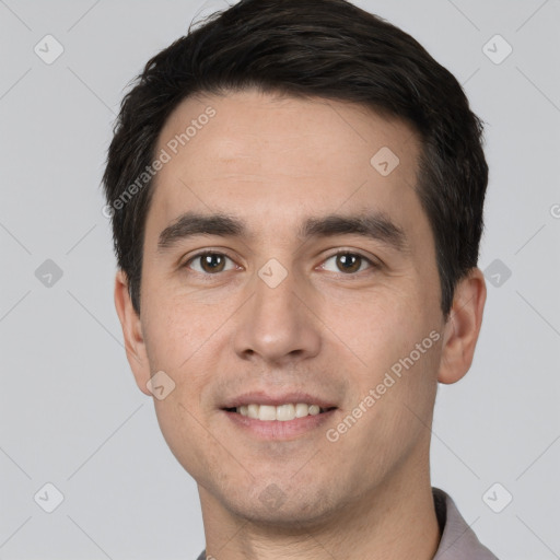 Joyful white young-adult male with short  black hair and brown eyes