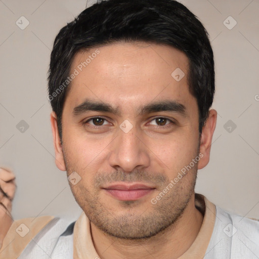 Joyful white young-adult male with short  black hair and brown eyes