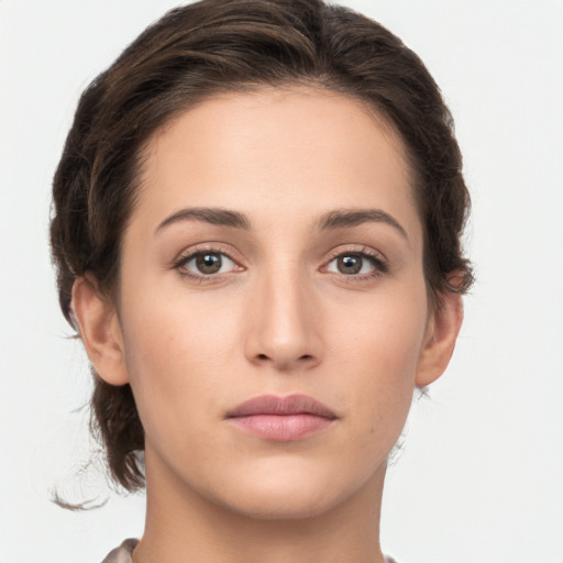 Neutral white young-adult female with short  brown hair and brown eyes