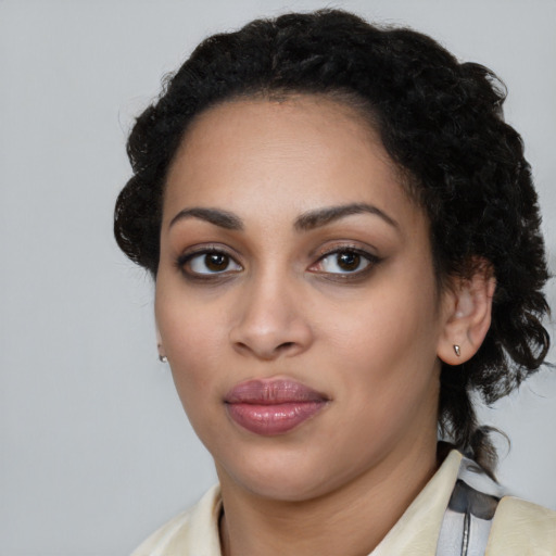 Joyful latino young-adult female with medium  black hair and brown eyes