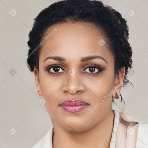 Joyful black young-adult female with short  brown hair and brown eyes