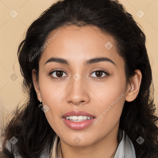 Joyful latino young-adult female with long  brown hair and brown eyes