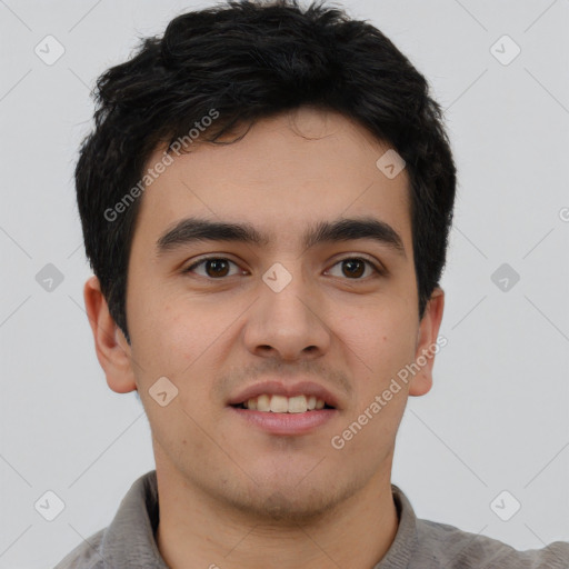 Joyful asian young-adult male with short  brown hair and brown eyes