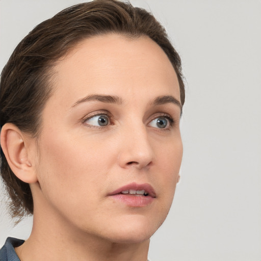 Neutral white young-adult female with medium  brown hair and grey eyes