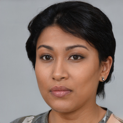 Neutral latino young-adult female with medium  black hair and brown eyes