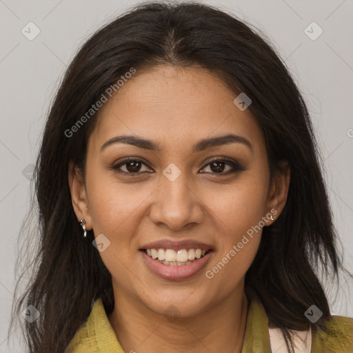 Joyful latino young-adult female with long  brown hair and brown eyes