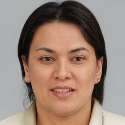 Joyful white adult female with medium  brown hair and brown eyes