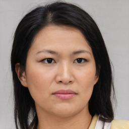 Neutral asian young-adult female with medium  brown hair and brown eyes