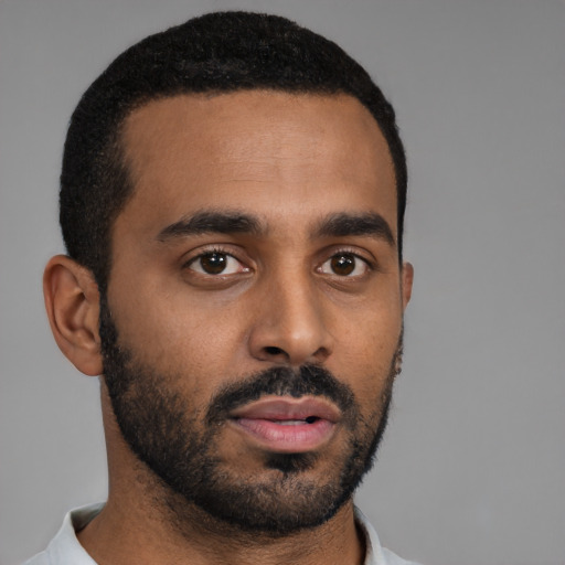 Neutral black young-adult male with short  black hair and brown eyes