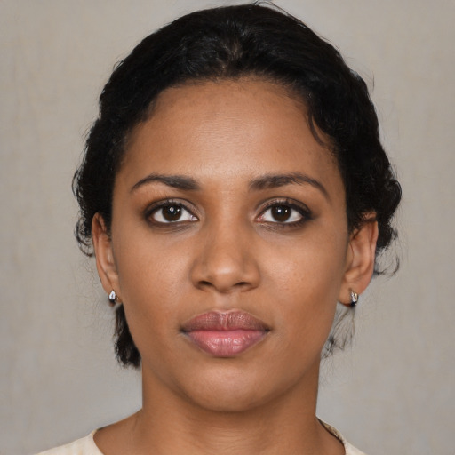 Neutral black young-adult female with medium  black hair and brown eyes