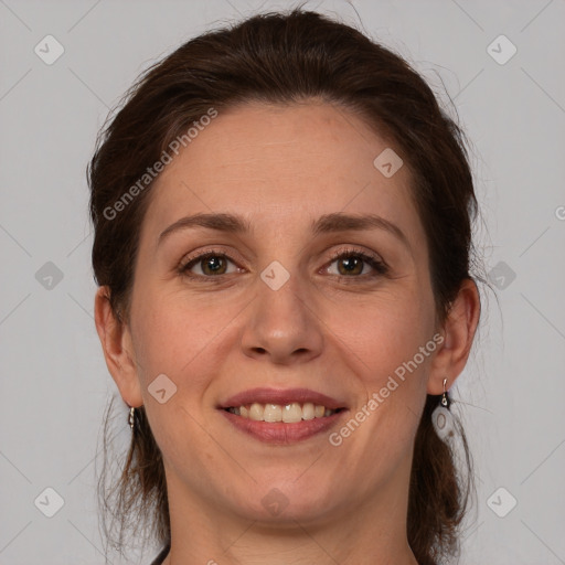 Joyful white adult female with medium  brown hair and grey eyes