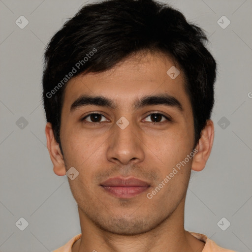 Joyful latino young-adult male with short  black hair and brown eyes