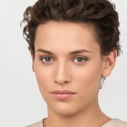 Neutral white young-adult female with short  brown hair and brown eyes