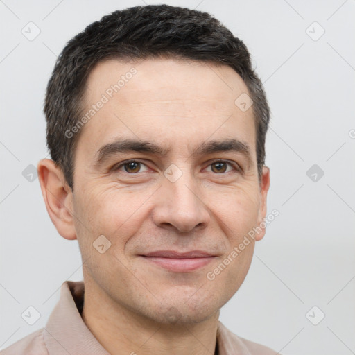 Joyful white adult male with short  brown hair and brown eyes