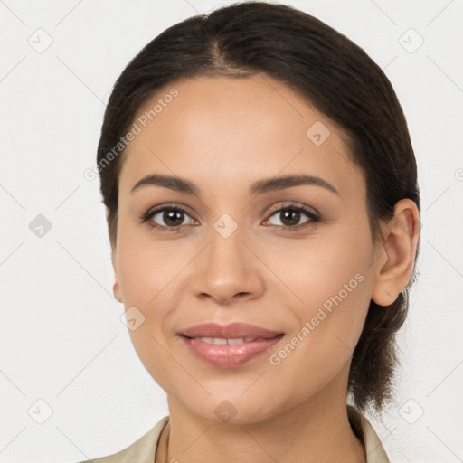 Joyful latino young-adult female with medium  brown hair and brown eyes