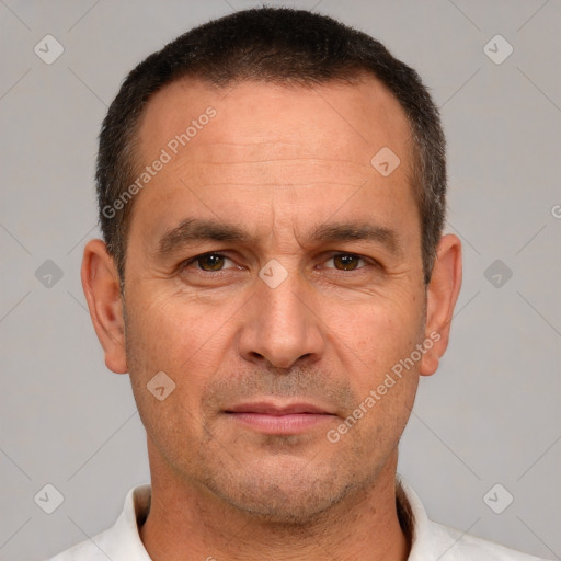 Joyful white adult male with short  brown hair and brown eyes