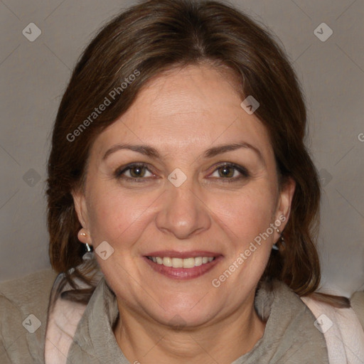 Joyful white adult female with medium  brown hair and brown eyes