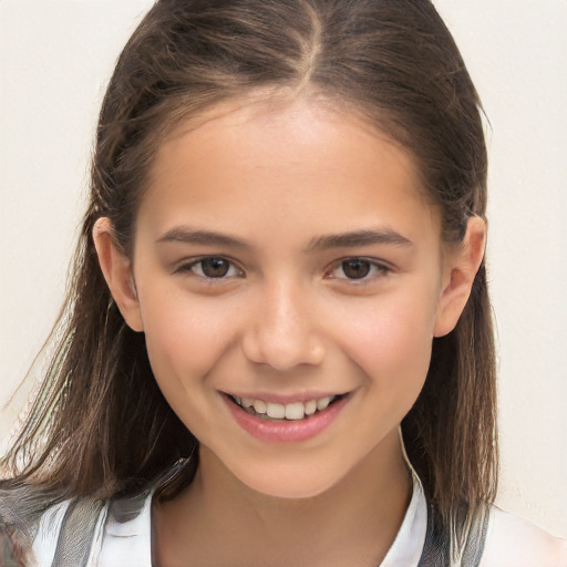 Joyful white child female with long  brown hair and brown eyes