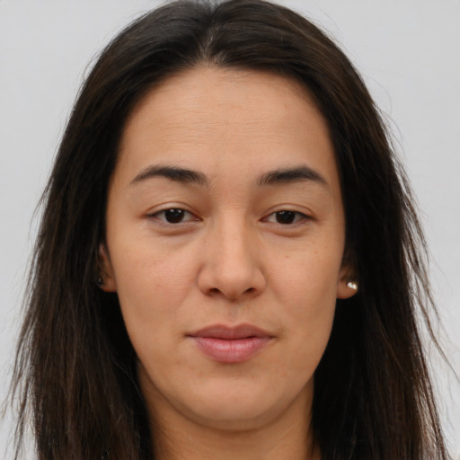 Joyful white young-adult female with long  brown hair and brown eyes