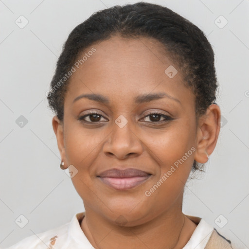 Joyful black young-adult female with short  brown hair and brown eyes