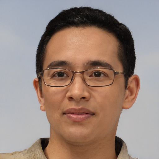 Joyful asian young-adult male with short  black hair and brown eyes
