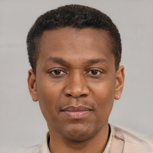 Neutral latino young-adult male with short  brown hair and brown eyes