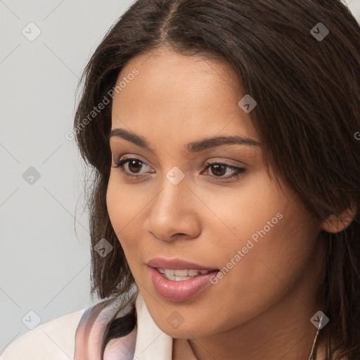 Neutral white young-adult female with long  brown hair and brown eyes