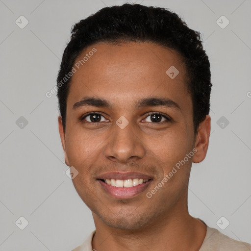 Joyful latino young-adult male with short  black hair and brown eyes