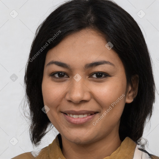 Joyful latino young-adult female with medium  brown hair and brown eyes