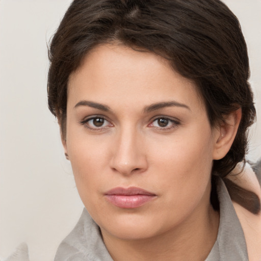 Neutral white young-adult female with short  brown hair and brown eyes