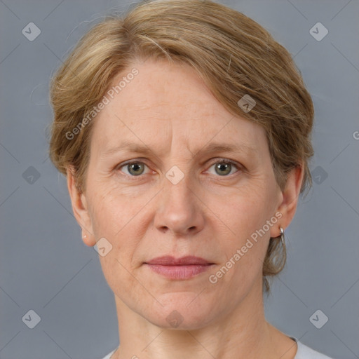 Joyful white adult female with medium  brown hair and grey eyes