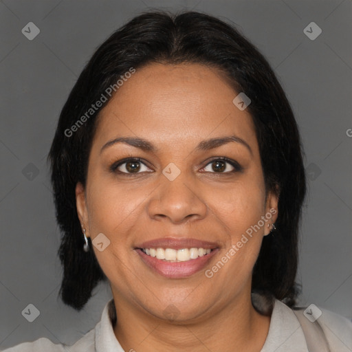 Joyful black adult female with medium  brown hair and brown eyes