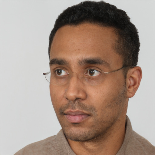 Neutral black young-adult male with short  black hair and brown eyes